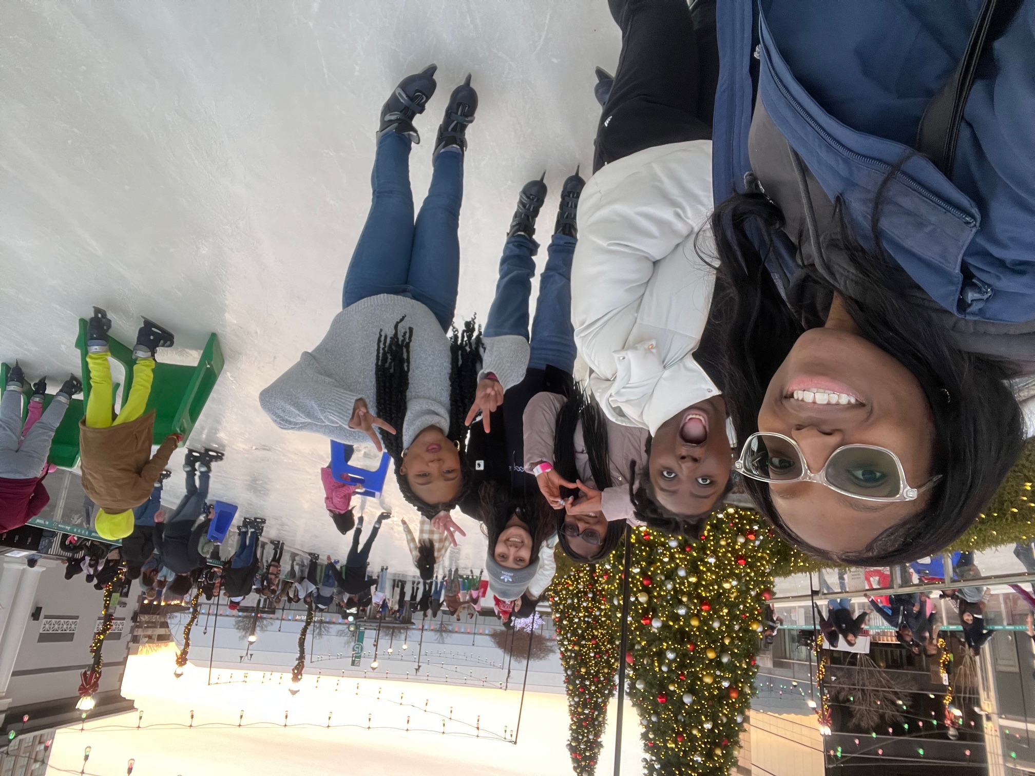 A group photo at an indoor ice rink