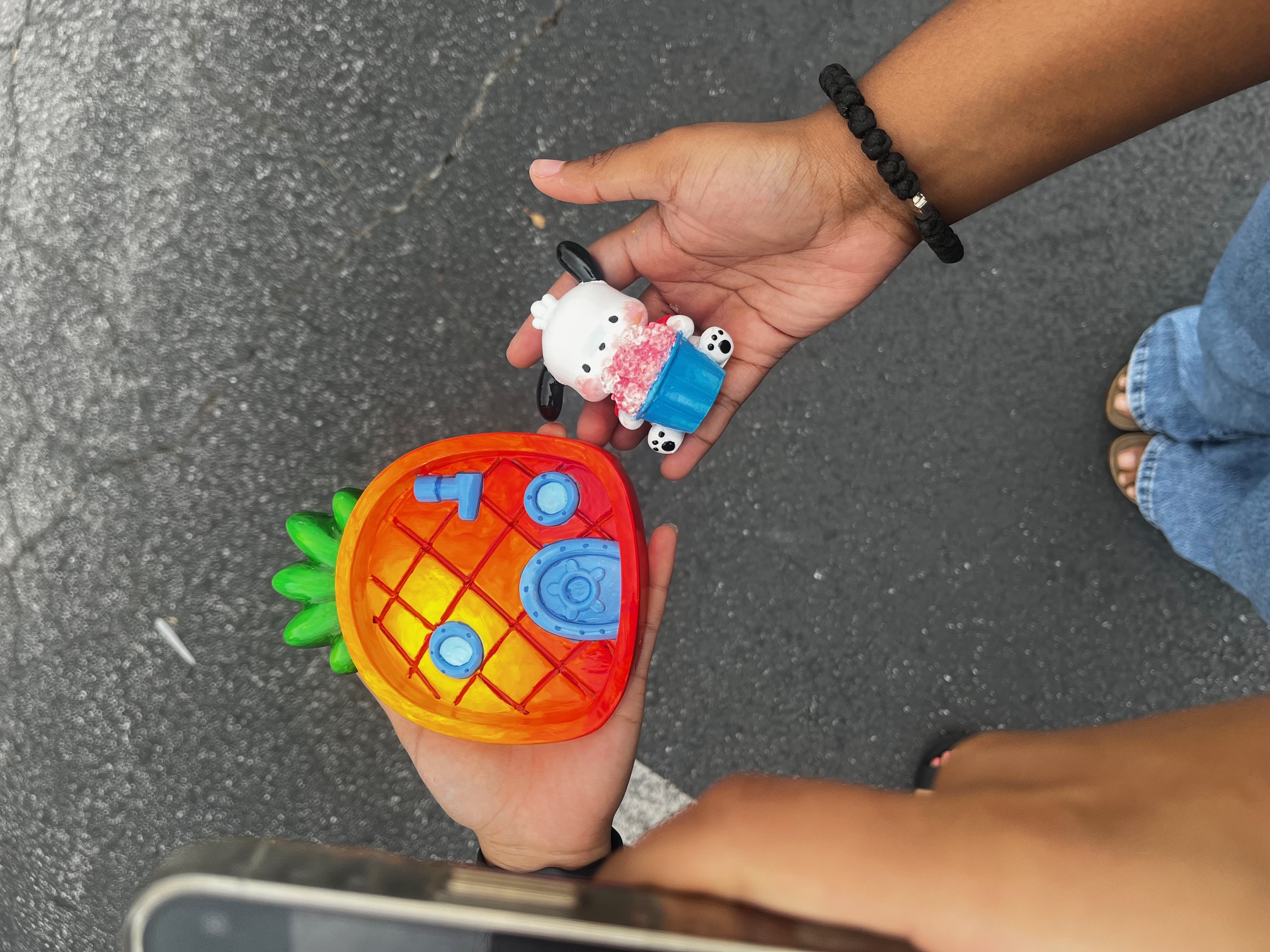 Decorated pumpkins painted as a pineapple house and a character